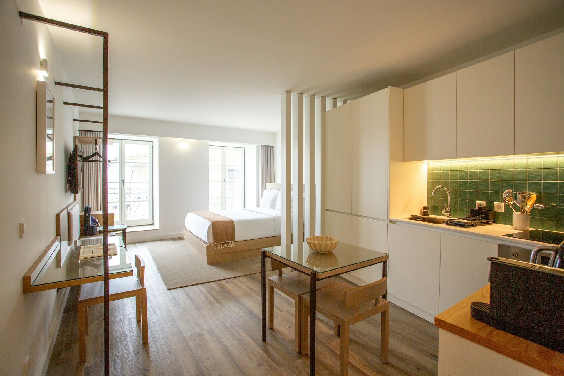 a kitchen with a table and chairs in it